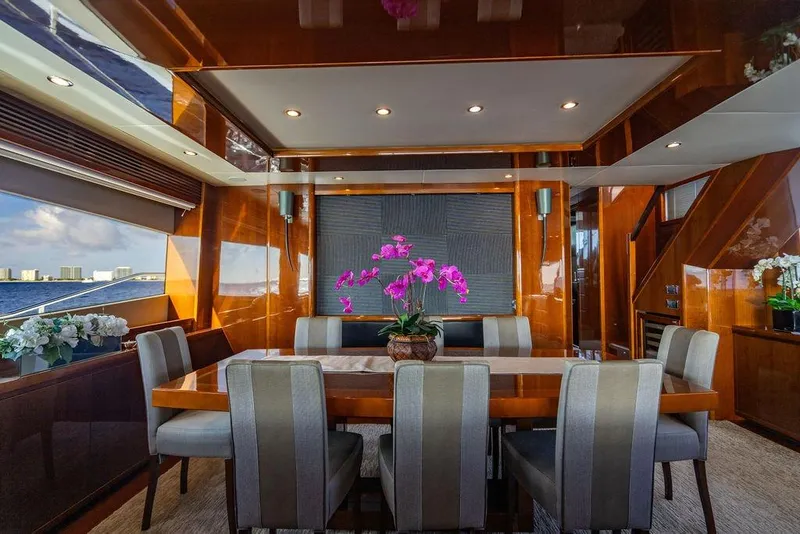 Slide: The Image of Luxurious dining area on a 2010 Princess 95 Motor Yacht with elegant decor and ocean view. - 14