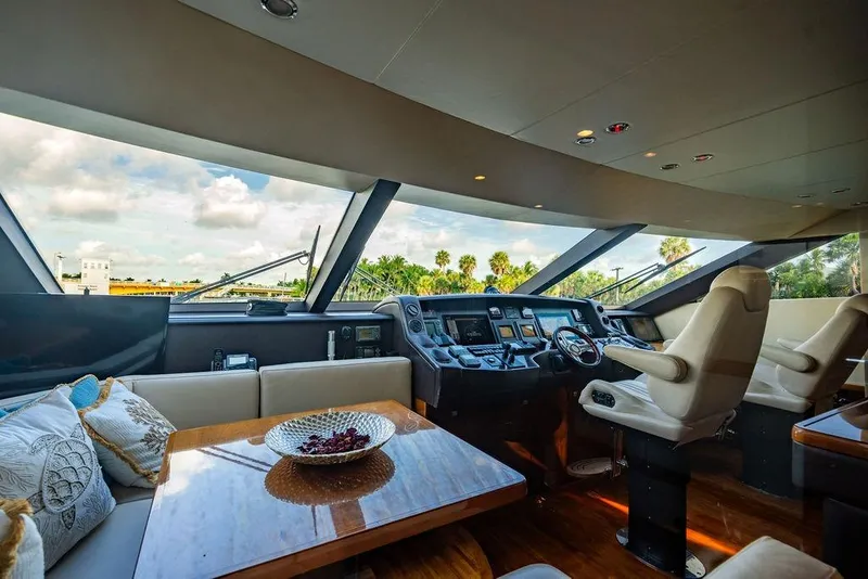 Slide: The Image of Luxurious interior of 2010 Princess 95 Motor Yacht with modern helm and seating area. - 16