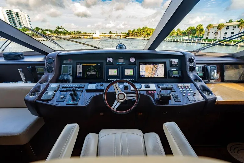 Slide: The Image of Cockpit of 2010 Princess 95 Motor Yacht with advanced navigation controls and scenic view. - 2