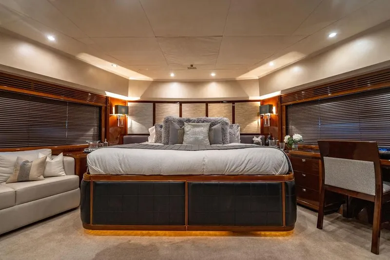 Slide: The Image of Luxurious bedroom interior of 2010 Princess 95 Motor Yacht with elegant furnishings. - 21