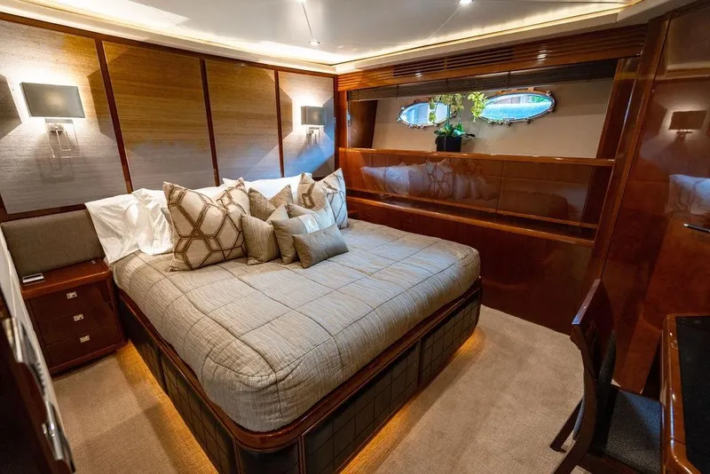 Slide: The Image of Luxurious bedroom interior of 2010 Princess 95 Motor Yacht with elegant decor and plush bedding. - 22