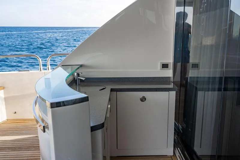 Slide: The Image of Luxurious outdoor bar area on a 2010 Princess 95 Motor Yacht, overlooking the ocean. - 24