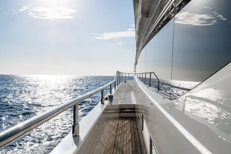 Slide: The Image of Side view of 2010 Princess 95 Motor Yacht cruising on a sunny ocean. - 31