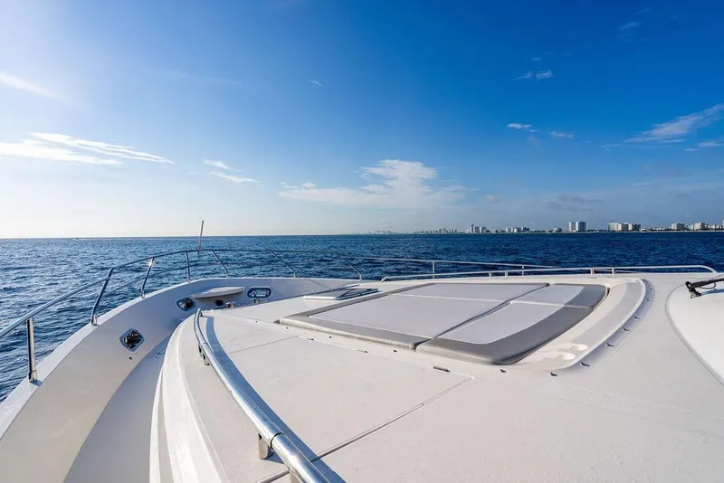 Slide: The Image of 2010 Princess 95 Motor Yacht deck with ocean view and clear blue sky. - 32