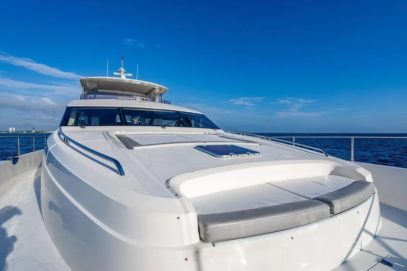 Slide: The Image of 2010 Princess 95 Motor Yacht on open sea under clear blue sky. - 34