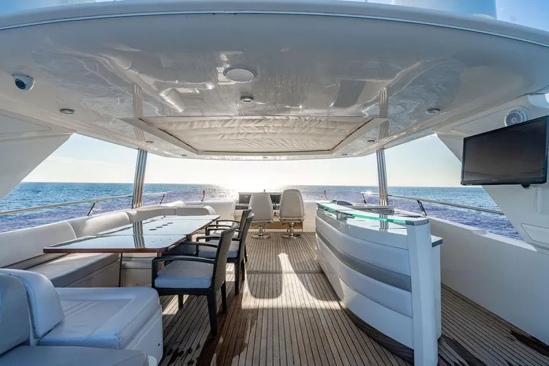 Slide: The Image of Luxurious 2010 Princess 95 Motor Yacht deck with seating, table, and ocean view. - 39