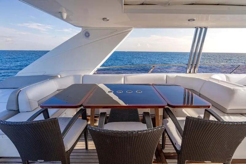 Slide: The Image of Luxurious 2010 Princess 95 Motor Yacht deck with elegant seating and ocean view. - 40