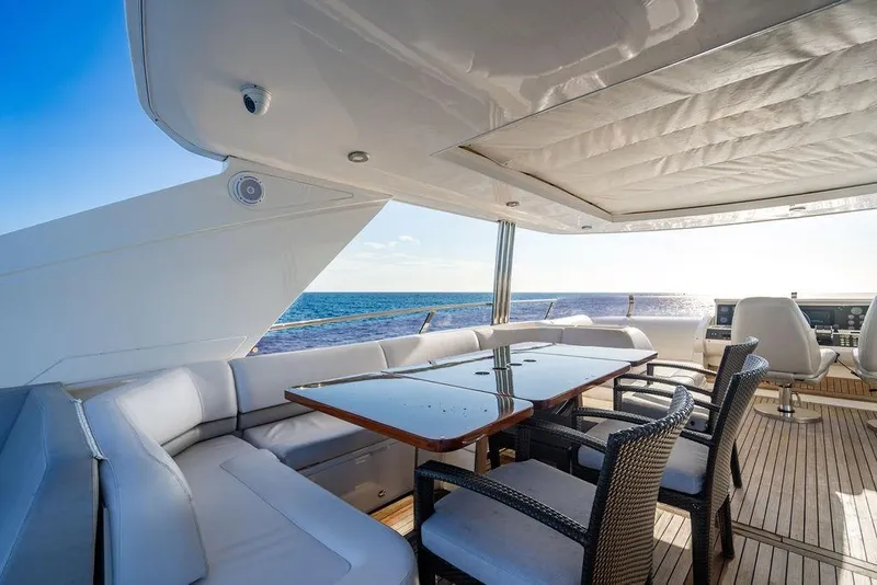 Slide: The Image of Luxurious 2010 Princess 95 Motor Yacht deck with elegant seating and ocean view. - 45