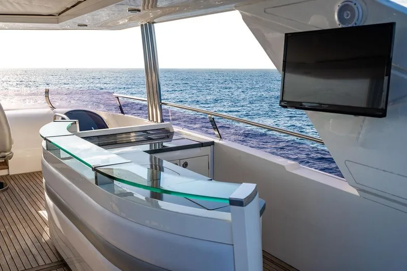 Slide: The Image of Luxurious 2010 Princess 95 Motor Yacht deck with ocean view and modern amenities. - 46