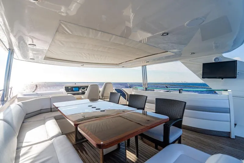 Slide: The Image of Luxurious 2010 Princess 95 Motor Yacht deck with seating, table, and ocean view. - 52