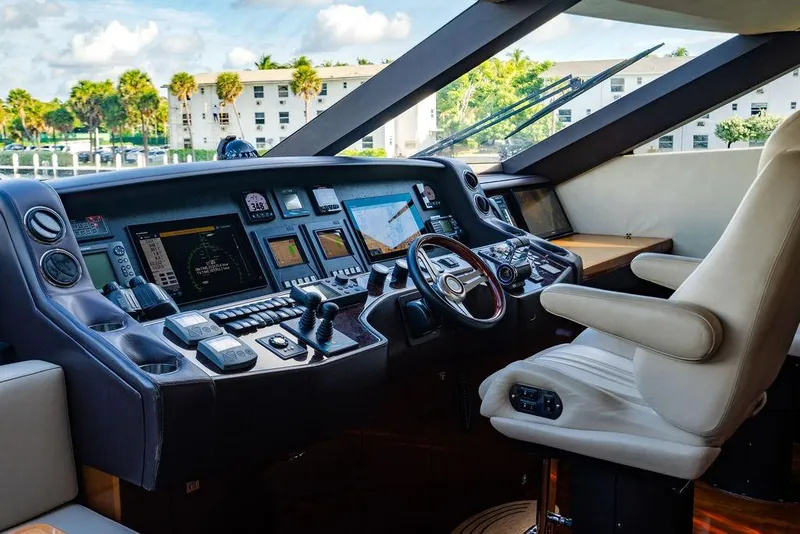Slide: The Image of Luxurious helm of 2010 Princess 95 Motor Yacht with advanced navigation controls. - 62