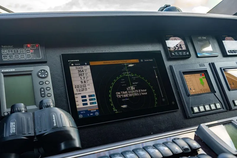 Slide: The Image of Control panel of a 2010 Princess 95 Motor Yacht with navigation and radar displays. - 64