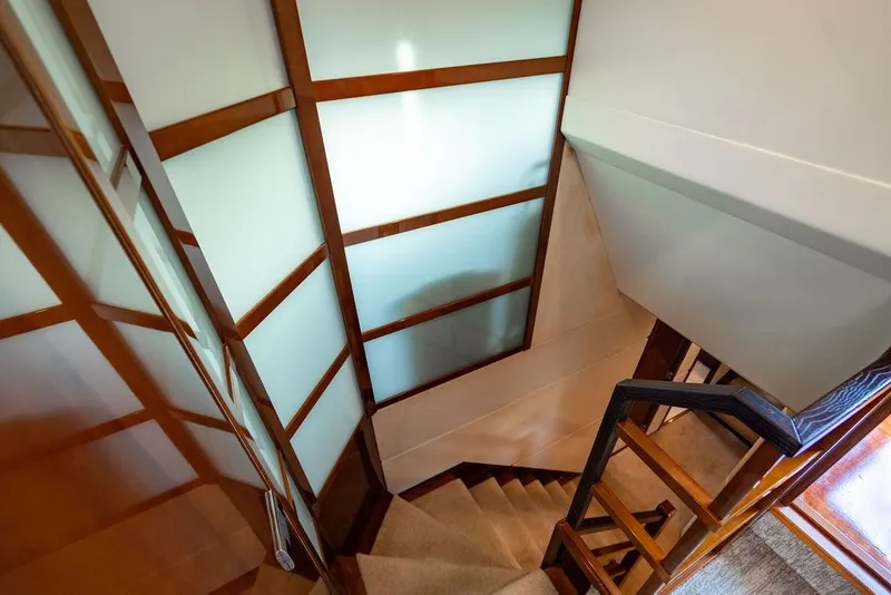 Slide: The Image of Staircase with wooden accents inside 2010 Princess 95 Motor Yacht. - 77