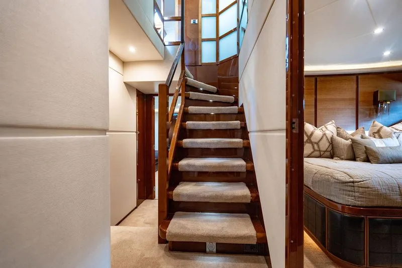 Slide: The Image of Luxurious interior of 2010 Princess 95 Motor Yacht with elegant staircase and cozy bedroom. - 78