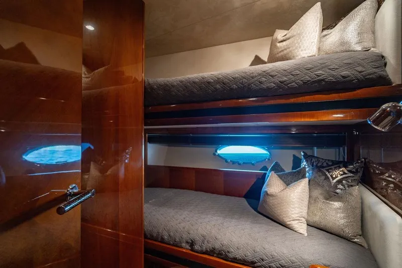 Slide: The Image of Luxurious cabin interior of 2010 Princess 95 Motor Yacht with bunk beds and elegant decor. - 86