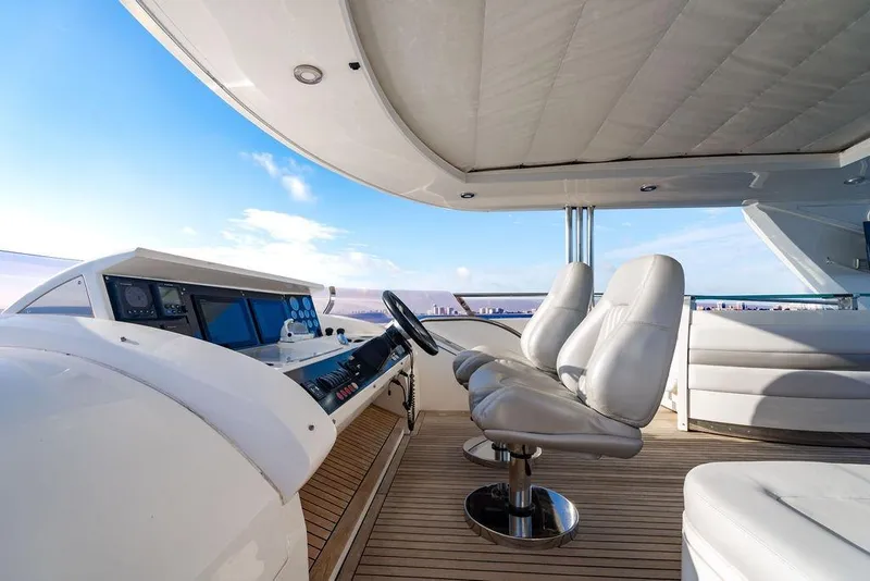 Slide: The Image of Luxurious 2010 Princess 95 Motor Yacht helm with plush seating and panoramic ocean views. - 9