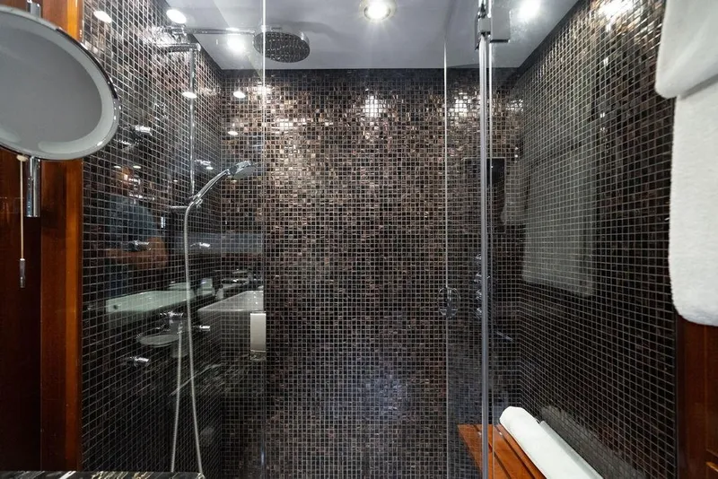 Slide: The Image of Luxurious shower with mosaic tiles in 2010 Princess 95 Motor Yacht bathroom. - 96