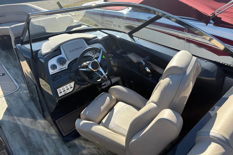 Slide: The Image of Interior of 2022 Crest Continental 250 boat with Garmin navigation system and plush seating. - 9