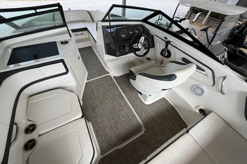 Slide: The Image of 2017 Sea Ray SPX 190 boat interior with modern seating and sleek dashboard design. - 10