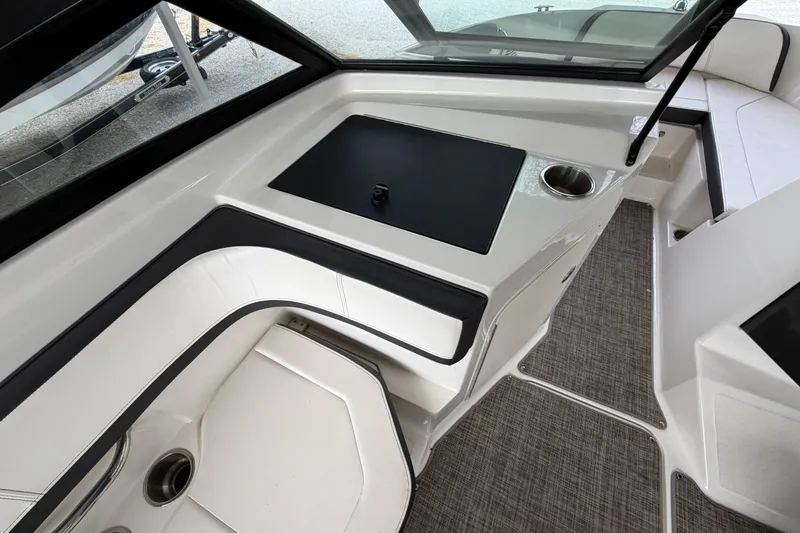 Slide: The Image of Interior view of 2017 Sea Ray SPX 190 boat, featuring seating and cup holders. - 14