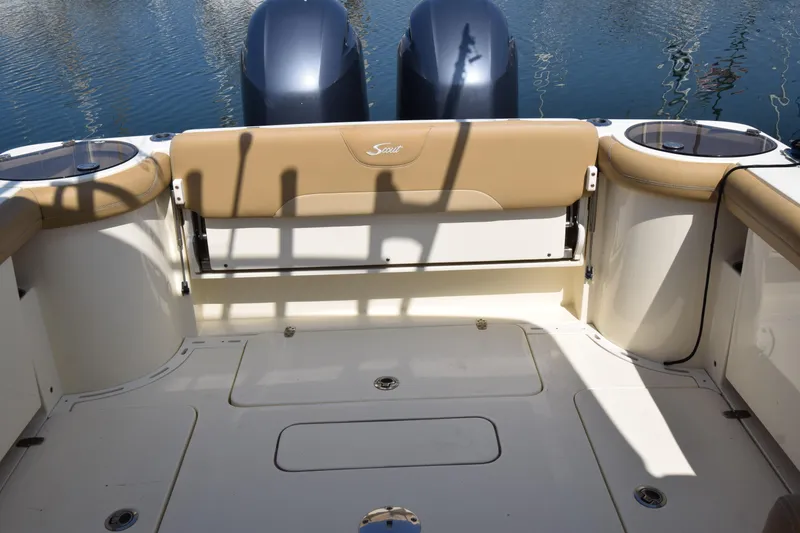 Slide: The Image of 2017 Scout 275 Dorado boat interior with dual engines and tan seating. - 17