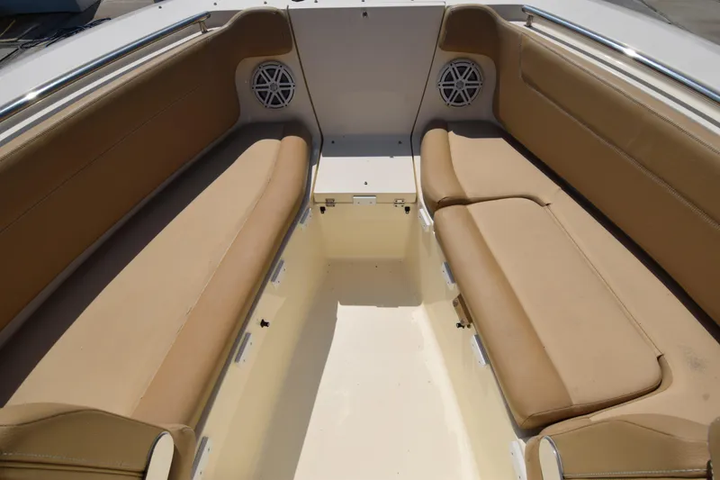 Slide: The Image of 2017 Scout 275 Dorado boat interior with tan seating and speakers. - 3