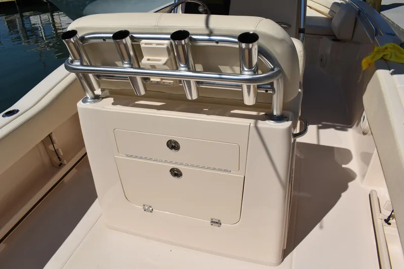 Slide: The Image of 2017 Grady-White Fisherman 257 boat interior with rod holders and storage compartments. - 14