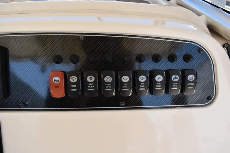 Slide: The Image of Storage compartment of 2017 Grady-White Fisherman 257 boat, featuring a secure latch. - 16