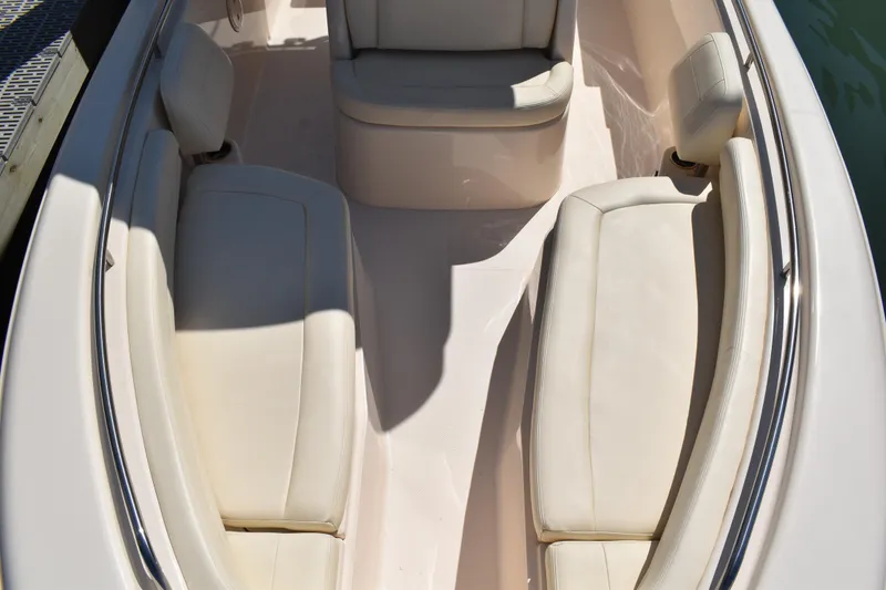 Slide: The Image of 2017 Grady-White Fisherman 257 boat dashboard view at marina with gazebo and flags. - 22