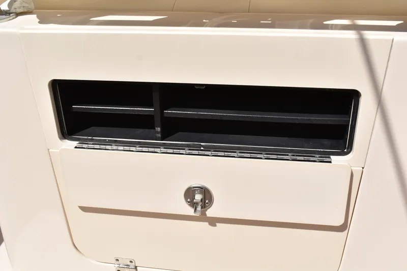 Slide: The Image of 2017 Grady-White Fisherman 257 boat interior at dock, showcasing seating and controls. - 28