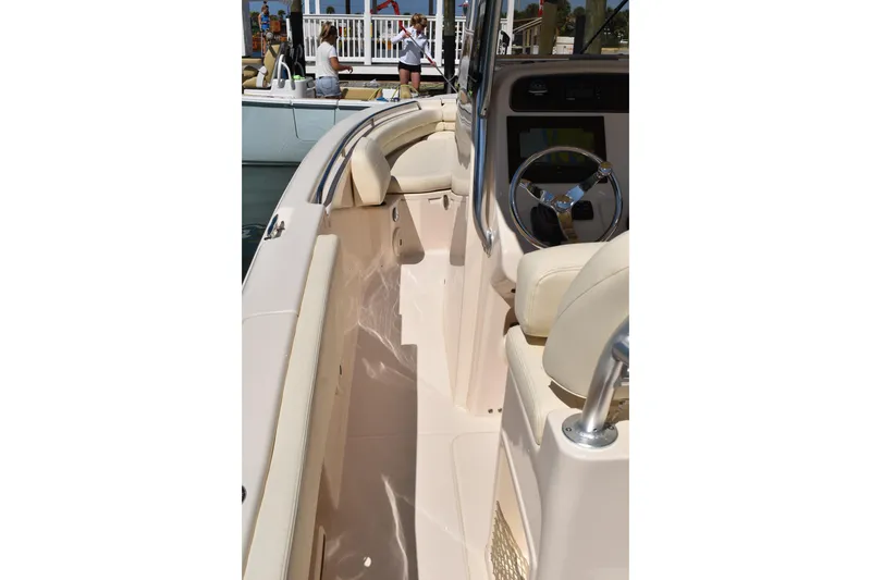 Slide: The Image of 2017 Grady-White Fisherman 257 boat interior with white cushioned seating. - 33