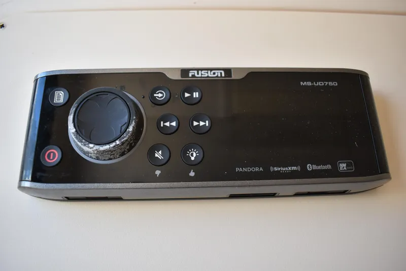 Slide: The Image of 2017 Grady-White Fisherman 257 boat on lift, displayed outdoors against blue sky. - 4