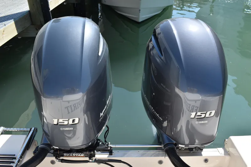 Slide: The Image of 2017 Grady-White Fisherman 257 boat interior with dual engines and seating area. - 6