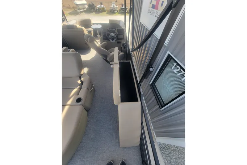 Slide: The Image of Interior view of 2026 SunChaser Geneva Cruise 24 LR DH Sport pontoon boat. - 2