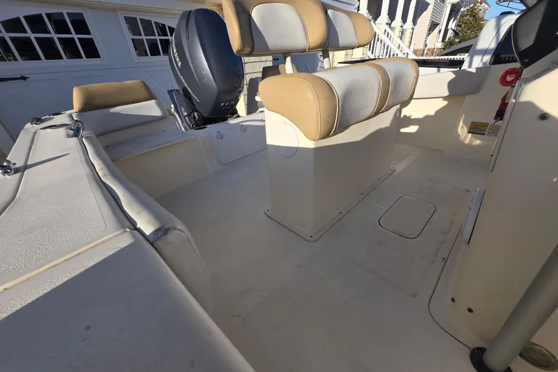 Slide: The Image of 2015 Scout 195 Sportfish boat interior with Yamaha engine and cushioned seating. - 10