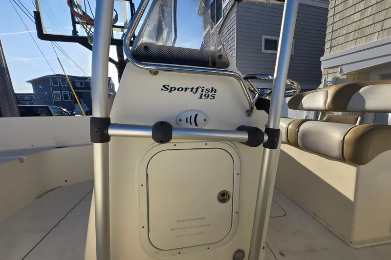 Slide: The Image of 2015 Scout 195 Sportfish boat interior with seating and console. - 12
