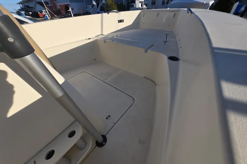 Slide: The Image of 2015 Scout 195 Sportfish boat interior with seating and storage compartments. - 9