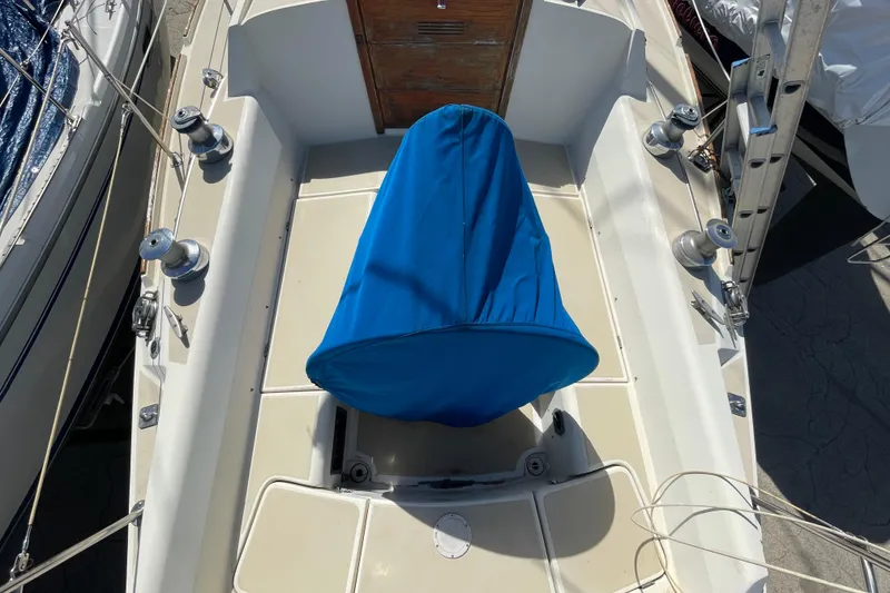 Slide: The Image of Cockpit instruments of a 1982 O'Day 34 sailboat, featuring navigation and wind gauges. - 10