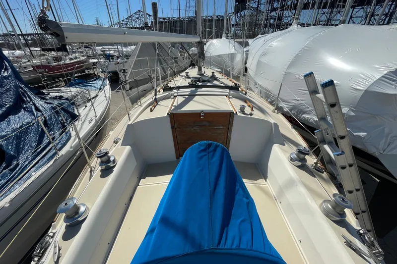 Slide: The Image of 1982 O'Day 34 sailboat cockpit with blue cushions and steering wheel. - 11