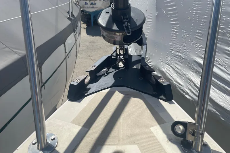 Slide: The Image of 1982 O'Day 34 sailboat deck with rigging, docked alongside covered boats. - 16