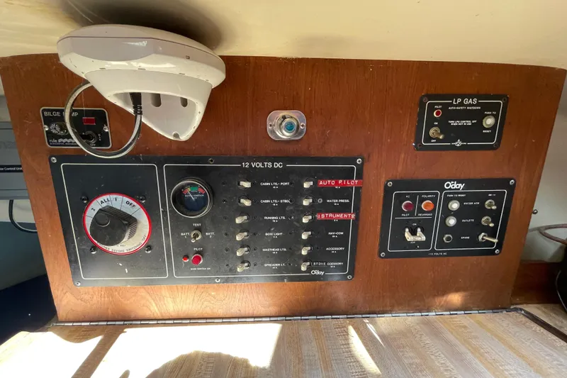 Slide: The Image of Interior of 1982 O'Day 34 sailboat galley with stove, sink, and wooden cabinetry. - 20