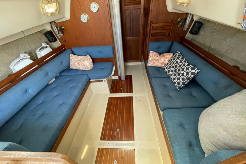 Slide: The Image of Control panel of a 1982 O'Day 34 sailboat with various switches and gauges. - 22