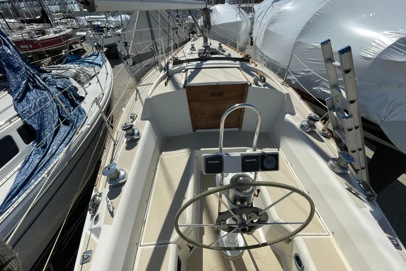 Slide: The Image of 1982 O'Day 34 sailboat keel on a stand, with a bag nearby. - 6