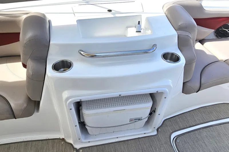 Slide: The Image of 2014 Hurricane SunDeck Sport 203 OB boat interior with seating and storage compartment. - 13
