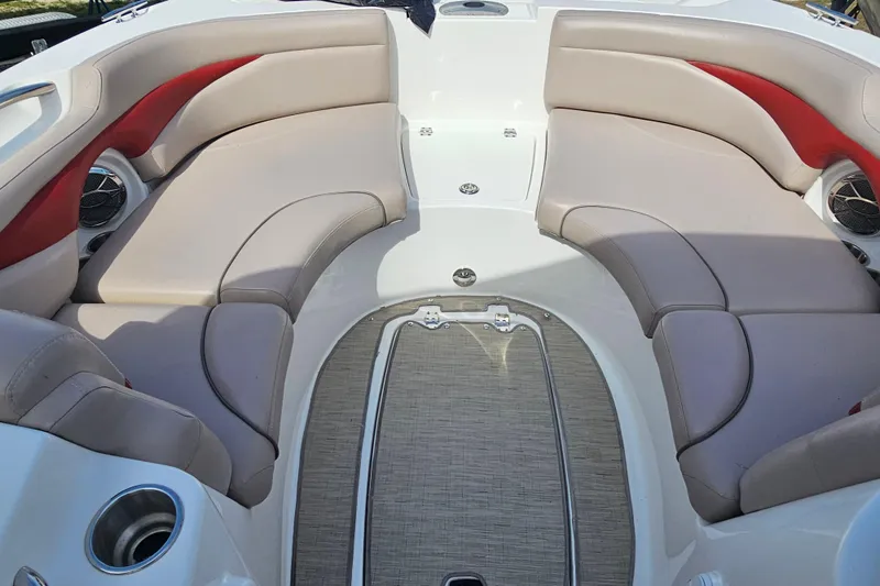 Slide: The Image of 2014 Hurricane SunDeck Sport 203 OB boat interior with beige and red seating. - 14