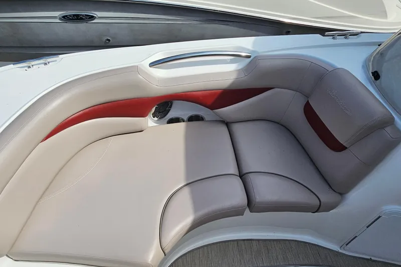 Slide: The Image of 2014 Hurricane SunDeck Sport 203 OB boat interior with beige and red cushioned seating. - 15