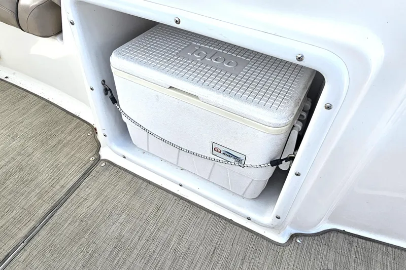 Slide: The Image of 2014 Hurricane SunDeck Sport 203 OB with built-in cooler storage compartment. - 19