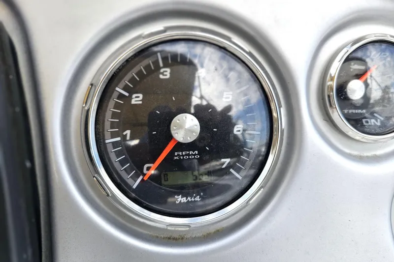 Slide: The Image of Close-up of a 2014 Hurricane SunDeck Sport 203 OB tachometer displaying RPM. - 25