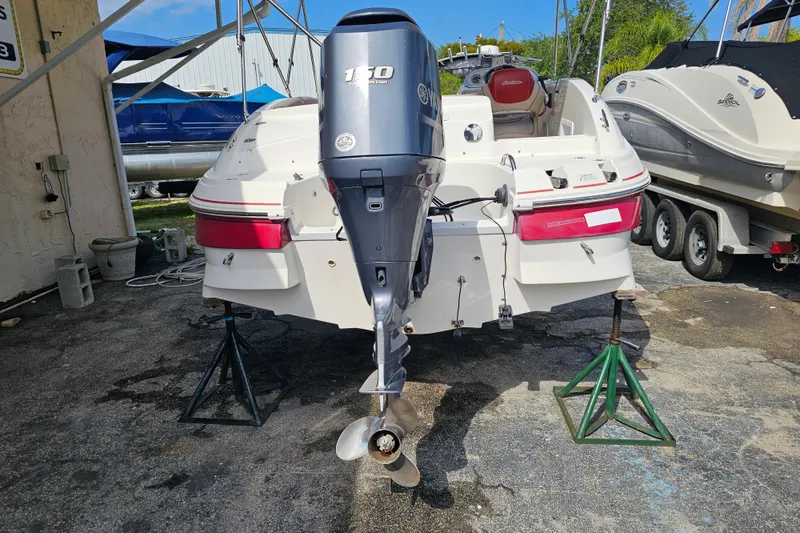 Slide: The Image of 2014 Hurricane SunDeck Sport 203 OB boat with Yamaha 150 outboard motor on stands. - 6