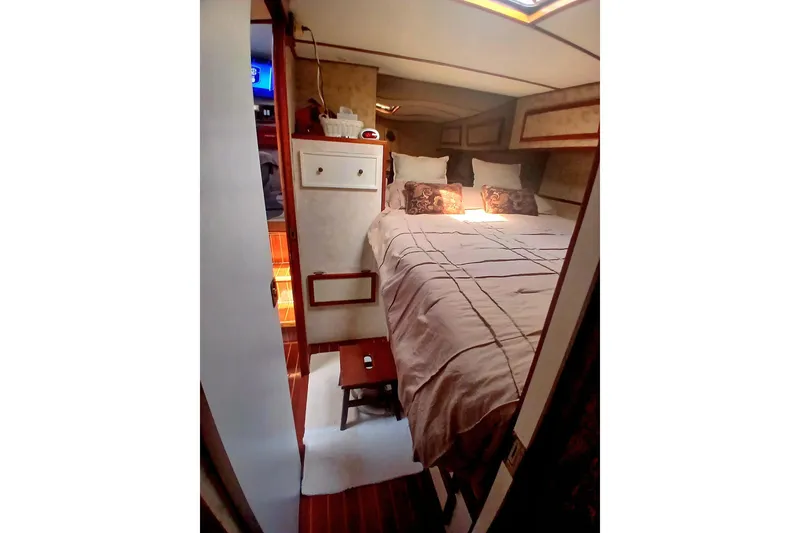 Slide: The Image of Cozy bedroom interior of 1976 Viking 40 Sedan Diesel yacht with elegant bedding. - 20